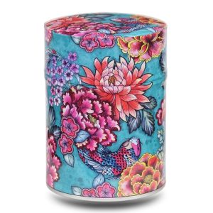 Metal tea caddy illustrated with carp and aquatic plants on a blue background