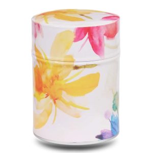 Metal tea caddy illustrated with a large yellow iris on a pinkish-beige background