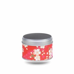 Small metal tea box covered with red washi paper with white flowers