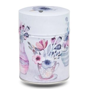 Metal tea caddy illustrated with a design of several bouquets of flowers on a white background.