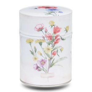 Metal tea caddy illustrated with a bouquet of wild flowers on a beige background.