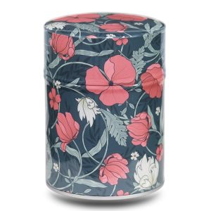 Metal tea caddy illustrated with red flowers on a dark green background